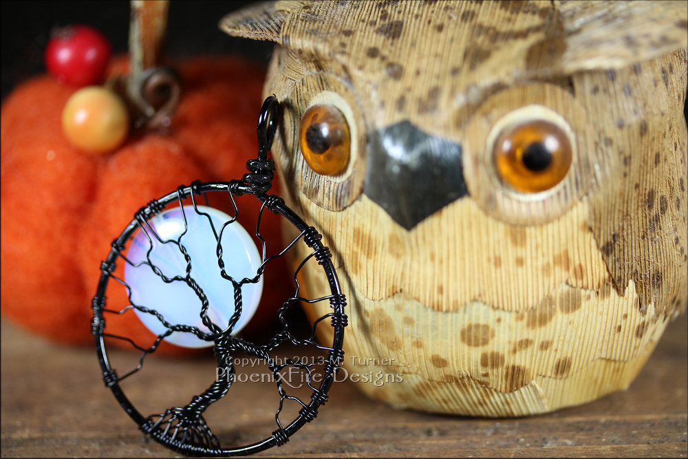 This Halloween inspired Full Moon Tree of Life Pendant features a beautiful Opalite Rainbow Moonstone "moon" behind the bare branches of a tree against a night sky.