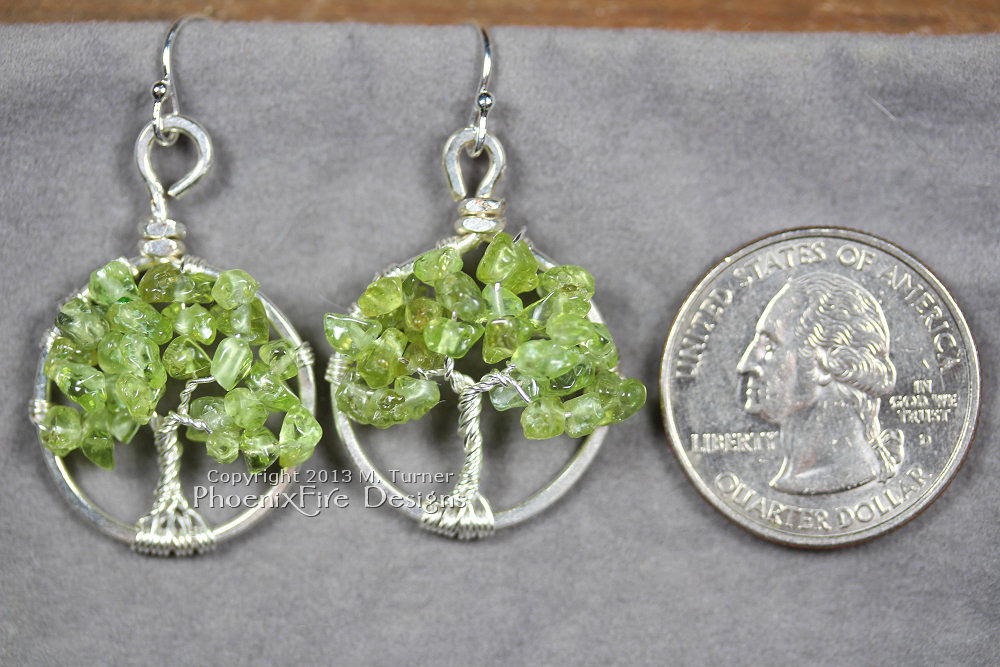 This pair of dainty Tree of Life earrings features genuine, natural Peridot gemstones and hangs on .925 sterling silver French ear wire hooks. Handmade wire wrapped original artisan jewelry by Miss M. Turner of PhoenixFIre Designs