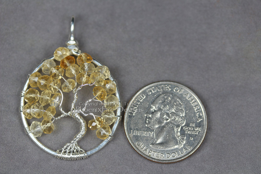 Soft, pale shaded yellow faceted citrine rondelle gemstones are the centerpiece of this Tree of Life pendant handmade wire wrapped in silver wire. Birthstone of November.