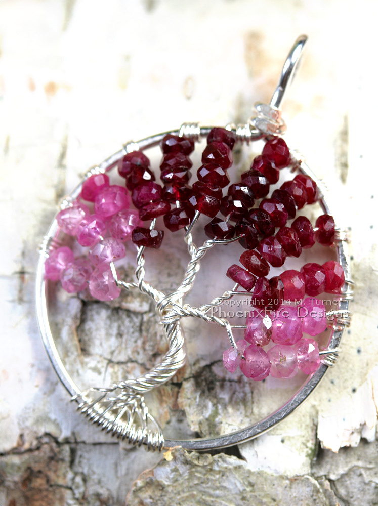 Tree of Life pendant in stunning shaded ombre red, raspberry and pink ruby rondelles wire wrapped in silver wire feature July's precious gemstone birthstone by PhoenixFire Designs.