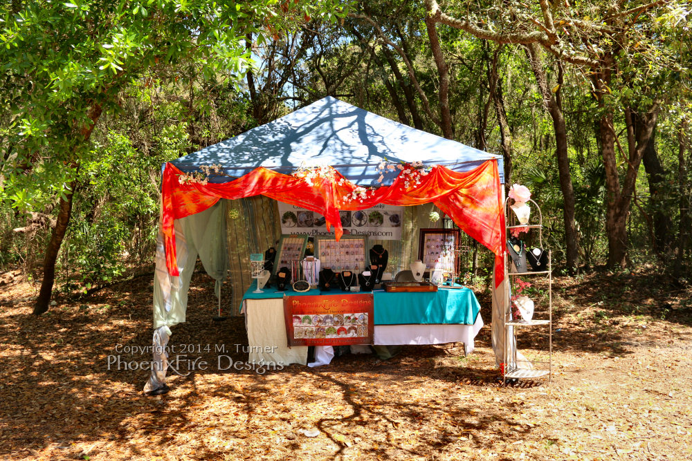 PhoenixFire Designs tent and wares on display as a vendor at the Bay Area Renaissance Festival in Tampa