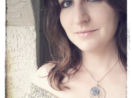 Miss M. Turner of PhoenixFire Designs modeling blue labradorite full moon wire wrapped tree of life pendant. Grey feldspar with blue flash, each pendant is handmade for a unique and beautiful necklace.