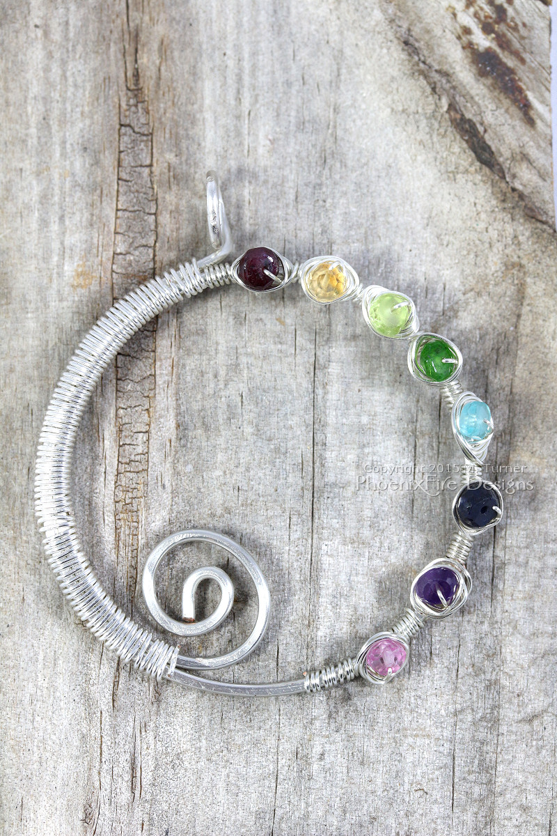 Handmade wire wrapped rainbow spiral eternity circle pendant by PhoenixFire Designs on etsy.