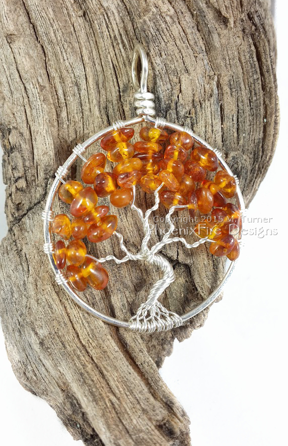 Handmade wire wrapped tree of life pendant in Baltic Amber autumn leaves silver wire wrap tree by Phoenix Fire Designs on etsy.