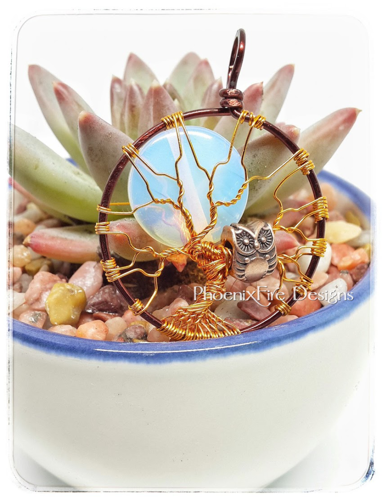 Opalite rainbow moonstone full moon tree of life, two tone mixed metal steampunk style brown and copper wire wrapped jewelry, with copper wire owl bead charm in the bare wire branches of this handmade artisan maker tree of life pendant by PhoenixFire Designs on etsy. Miniature succulent planted in china tea cup.