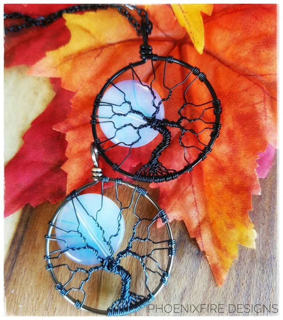 Best selling PhoenixFire Designs famous opalite moonstone full moon tree of life pendants handmade in black wire or gunmetal wire wrapped necklace.