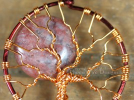 This Red Lodolite Autumn Harvest Full Moon Tree of Life pendant is wrapped in two tone brown and copper wire. Also known as Garden Quartz, Lodalite, Lodelite, and Inclusion Quartz as well.