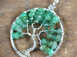 Stunning shaded ombre emerald rondelles in silver wire make up this handcrafted, wire wrapped Tree of Life Pendant featuring May's precious gemstone birthstone.