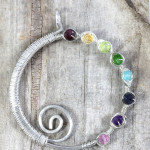 Handmade wire wrapped rainbow spiral eternity circle pendant by PhoenixFire Designs on etsy.