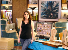 Jewelry Artist Miss M. Turner of PhoenixFire Designs stands in front of the local artisan showcase at the Vinoy Resort, St. Petersburg July 24, 2015