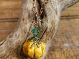 Handmade, orange howlite pumpkin necklace with brass leaf bead caps and Swarovski Crystal accent on antique copper chain. By PhoenixFire Designs